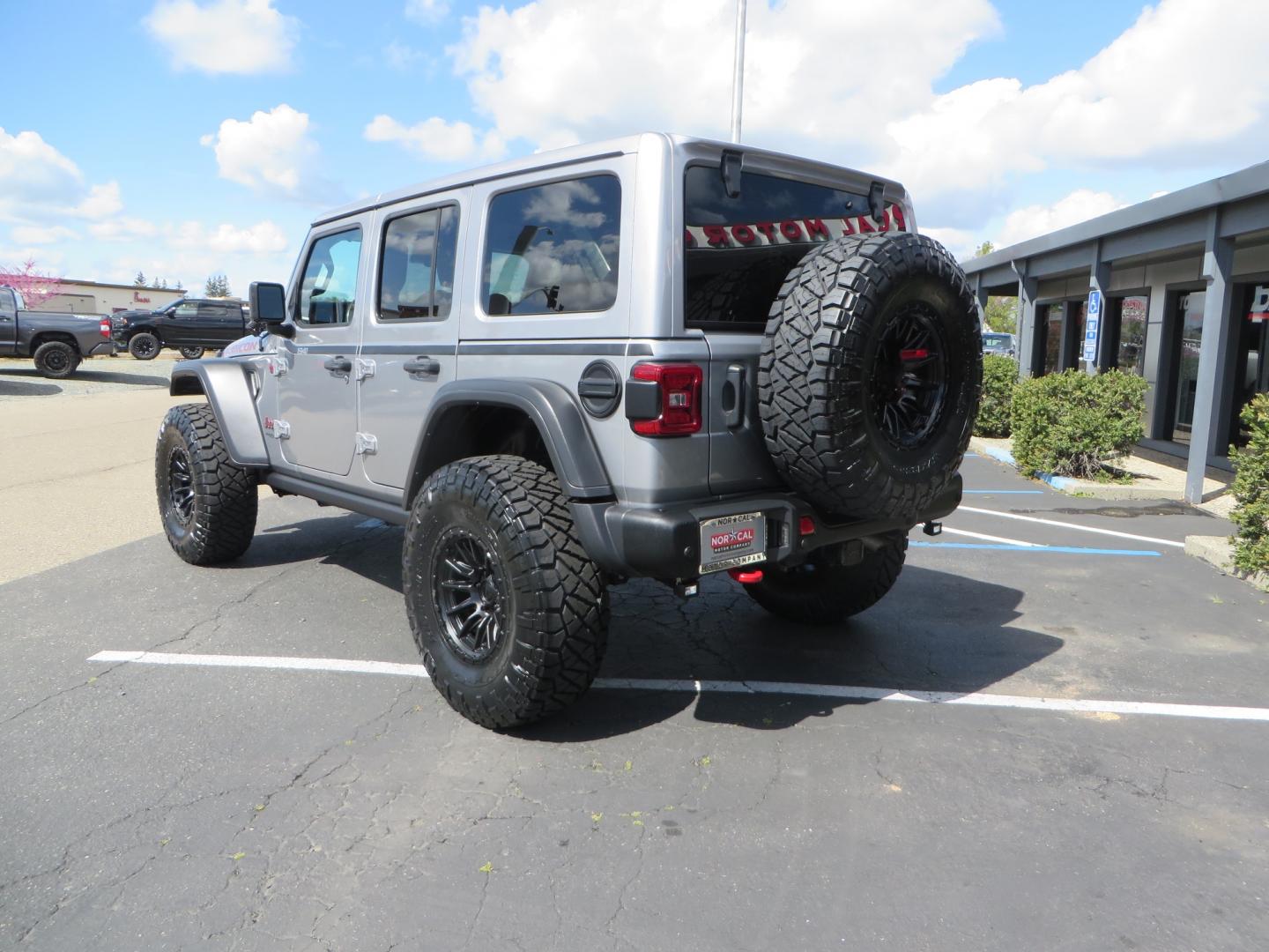 2021 SILVER /BLACK Jeep Wrangler Unlimited Rubicon (1C4HJXFG7MW) with an 3.6L V6 DOHC 24V FFV engine, 6A transmission, located at 2630 Grass Valley Highway, Auburn, CA, 95603, (530) 508-5100, 38.937893, -121.095482 - Features - Zone Offroad 3" Lift kit, Fox shocks, 37" Nitto Ridge Grappler tires, 17" Fuel Piston wheels, Warn winch, KC led lights, Voswitch switches, Teraflex HD tire relocation, Fire extinguisher, High Lift Jack, Shovel, Axe, Jumper Cables, and flat towable. - Photo#6